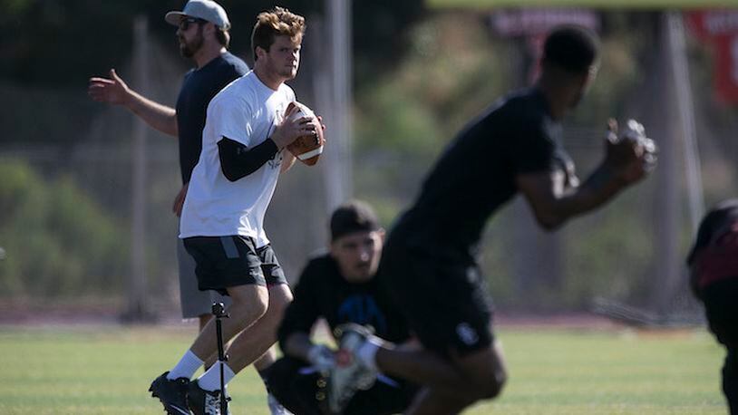 USC quarterback Sam Darnold at a spring workout with quarterbacks coach Jordan Palmer, left, at San Clemente High School on May 13, 2017.  (Robert Gauthier/Los Angeles Times/TNS)