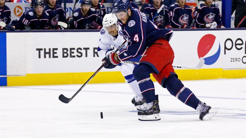 COLUMBUS, OH - APRIL 16: Scott Harrington #4 of the Columbus Blue Jackets and Mathieu Joseph #7 of the Tampa Bay Lightning chase after the puck during the first period of Game Four of the Eastern Conference First Round during the 2019 NHL Stanley Cup Playoffs on April 16, 2019 at Nationwide Arena in Columbus, Ohio. (Photo by Kirk Irwin/Getty Images)