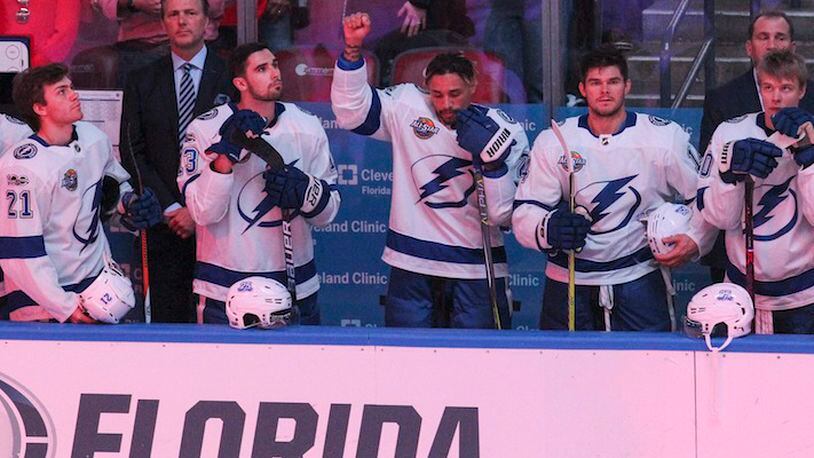 The Tampa Bay Lightning's J.T. Brown protests during the national anthem before the start of a game against the Florida Panthers at the BB&T Center in Sunrise, Fla., on October 7, 2017. (Matias J. Ocner/Miami Herald/TNS)