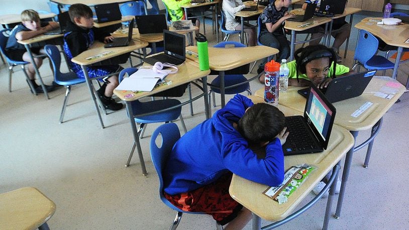 Third-graders in the classroom of Lauren Jones at the Fairborn Intermediate School study at their desks. MARSHALL GORBY\STAFF
