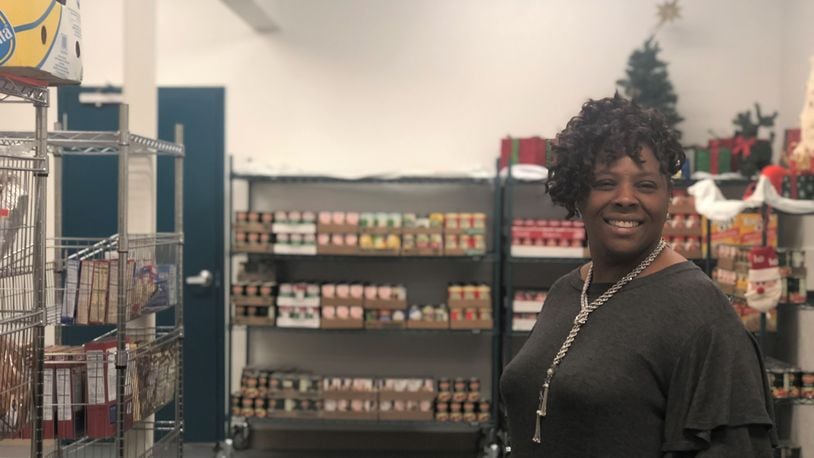 Yvette Kelly-Fields stands in the new climated-controlled food pantry at the Wesley Community Center. CORNELIUS FROLIK / STAFF