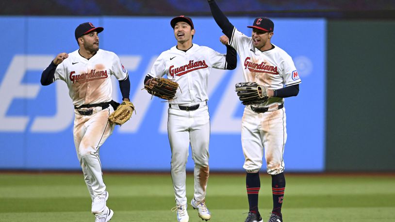 Cleveland Guardians' Ramón Laureano, Steven Kwan and Tyler Freeman, from left, celebrate the team's win over the Oakland Athletics in a baseball game Saturday, April 20, 2024, in Cleveland. (AP Photo/Nick Cammett)