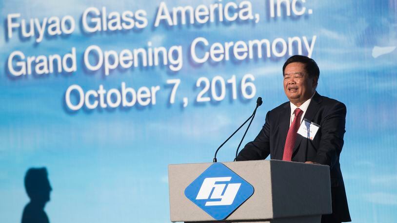 Cho Tak Wong, chairman of Fuyao Group, speaks during the grand opening of the Fuyao Glass America Moraine plant in October 2016. AP Photo/John Minchillo