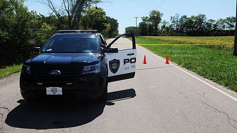 A Huber Heights police vehicle is shown in an investigation in the area of Wildcat and Kellenburger roads. MARSHALL GORBY/STAFF