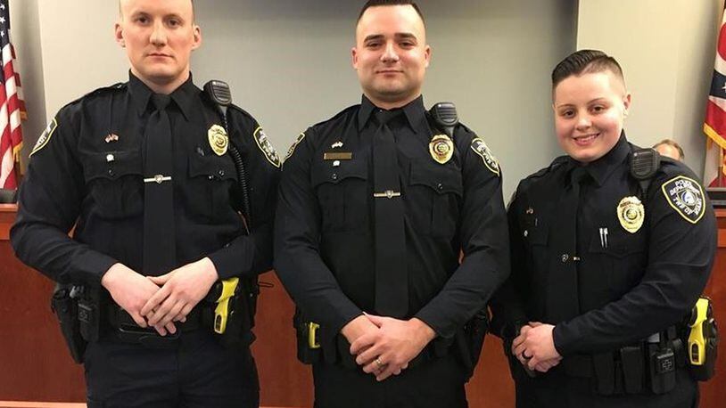 From left to right, Ethan Bens, William Olinger and Ashley Stacy took their oaths last month with the Miami Twp. Police Department. They will go through the field training officer program before being assigned to the patrol division, according to the township. CONTRIBUTED