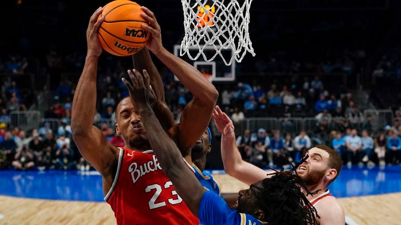 Ohio State forward Zed Key (23) rebounds the ball against UCLA during the second half of an NCAA college basketball game Saturday, Dec. 16, 2023, in Atlanta, Ga. (AP Photo/Brynn Anderson)