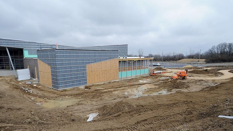 Construction of an $11.8 million branch of the Dayton Metro Library is ongoing in Huber Heights, related to a larger redevelopment of the former Marian Meadows shopping center near Brandt Pike and Fishburg Road. MARSHALL GORBY\STAFF