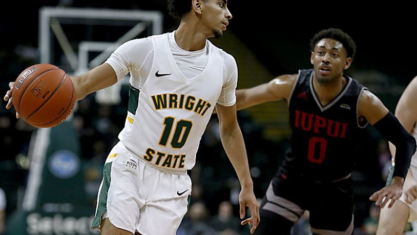 Wright State University guard Trey Calvin is covered by IUPUI guard Jaylen Minnett during their Horizon League game at the Nutter Center in Fairborn Sunday, Feb. 16, 2020. Wright State won 106-66. Contributed photo by E.L. Hubbard