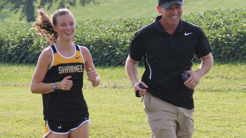 Miah and Brian DeSantis have helped make the Springfield Shawnee girls cross country team a powerhouse program. CONTRIBUTED PHOTO