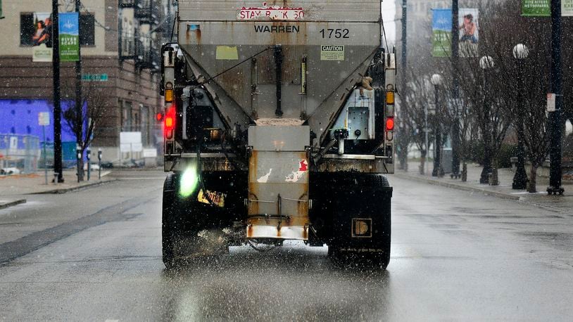 Dayton road crews were busy Monday, Jan. 30, 2023, salting Monument Avenue and other downtown streets. MARSHALL GORBY\STAFF