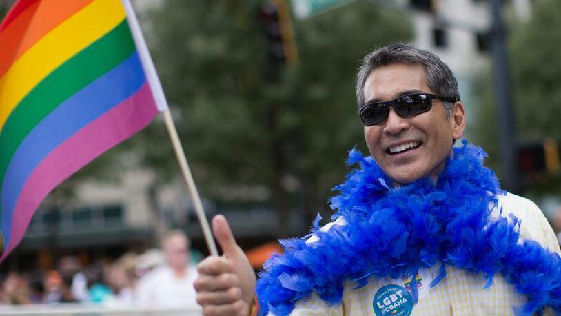 Former Atlanta City Councilman Alex Wan marches down Peachtree Street during the 2015 Atlanta Pride Parade. Wan has recently discovered that men are using his image to “catfish” Asian women around the world. (Photo: Branden Camp/The Atlanta Journal-Constitution)