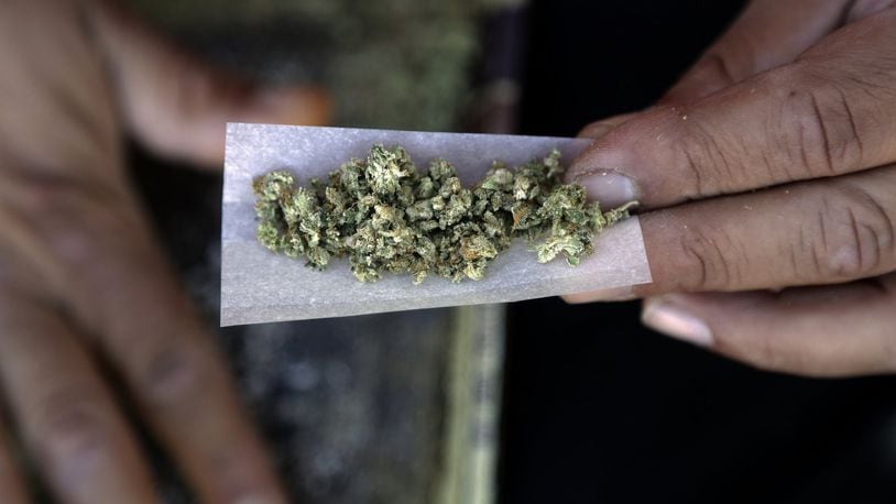 A marijuana joint is rolled. (AP Photo/Marcio Jose Sanchez)
