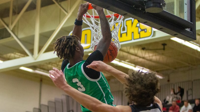 Northmont's Dalin Wilkins dunks early in the first half against Lebanon on Wednesday night at Centerville High School. Jeff Gilbert/CONTRIBUTED