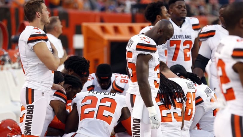 Members of the Cleveland Browns knelt in prayer during the national anthem before their game against the New York Giants on Aug. 21.
