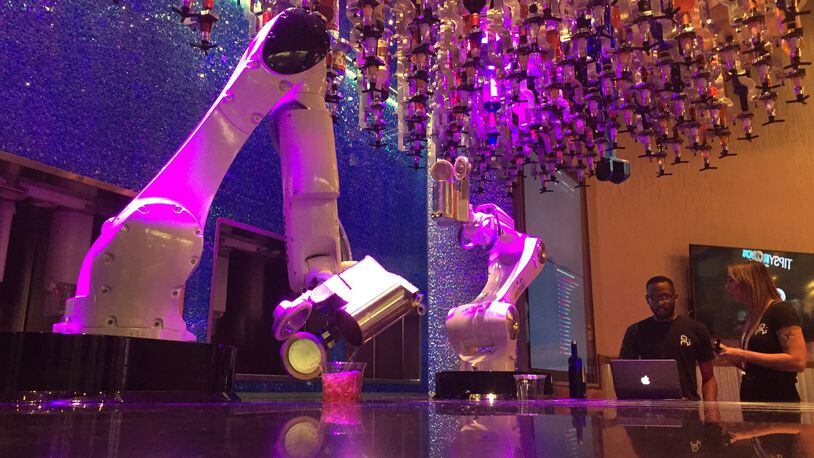 Robots serve drinks at The Tipsy Robot which opened inside the Miracle Mile Shops next to Planet Hollywood Casino in Las Vegas. (David Montero/Los Angeles Times/TNS)
