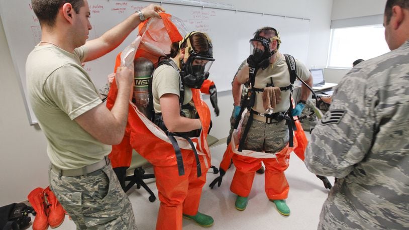 Students at the U.S. Air Force School of Aerospace Medicine practice hazardous materials scenarios in the apprentice program in this 2019 photo. This class included national guard, and active duty personnel. L-R A1C Jane Vierzen and A1C James Mainolfi wore full hazmat suits with respirators to complete their site reconnaissance health risk assessment training. Photo by Ty Greenlees