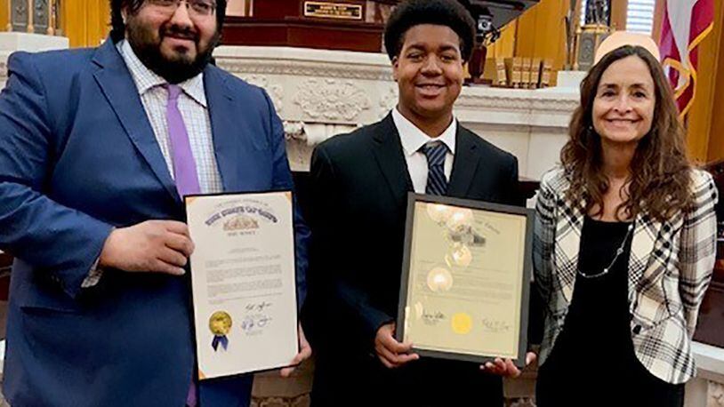 Jamari Jones (center) receives the 2022 Ohio Military Youth of the Year Award from state Sen. Niraj Antani (left) and state Rep. Andrea White on April 6 in Dayton. The Wright-Patterson Air Force Base teenager now moves on to compete at the regional level in Chicago. CONTRIBUTED PHOTO