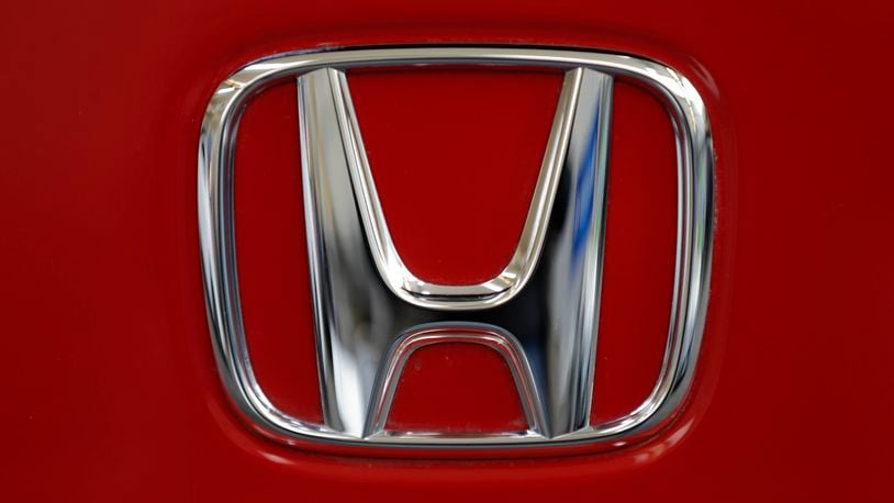FILE - This Feb. 14, 2013, file photo, shows a Honda logo on the trunk of a Honda automobile at the Pittsburgh Auto Show, in Pittsburgh. (AP Photo/Gene J. Puskar, File)