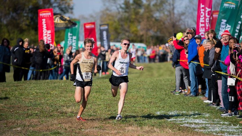 Wright State’s Nathan Dunn (right) battles Oakland’s Connor Goetz to the finish of the Horizon League cross country championships. Joseph Craven/WRIGHT STATE ATHLETICS