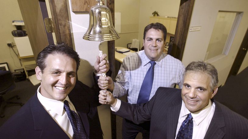 From a 2007 file photo: From left, Lastar, Inc. Vice Chairman Geoffrey Hyman, President Bill Diederich, and Chairman and CEO Michael Shane, hang on the bell that a salespeople ring once for every $1,000 on $1,000 and above orders.