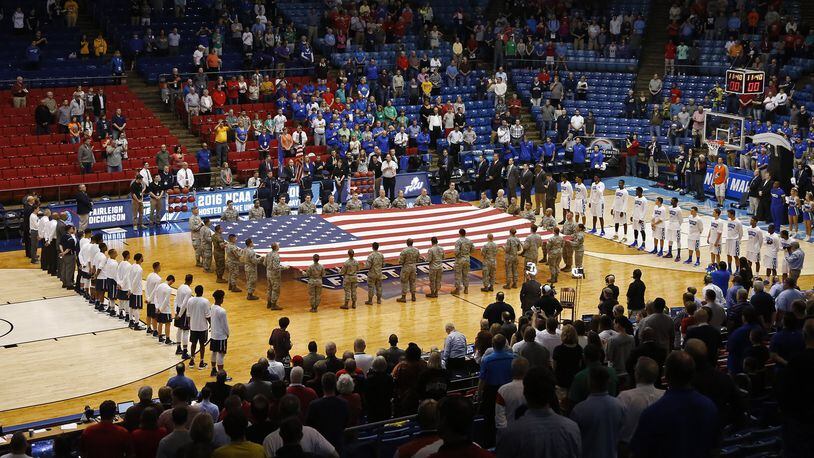 Airmen from Wright-Patterson Air Force Base presented the colors before the start of the NCAA First Four at UD Arena. TY GREENLEES / STAFF