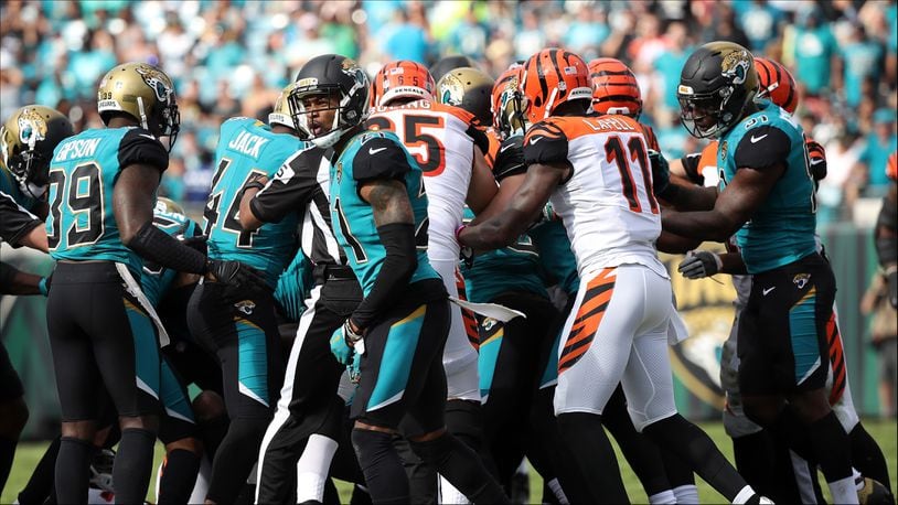 JACKSONVILLE, FL - NOVEMBER 05:  Members of the Cincinnati Bengals and Jacksonville Jaguars get into a scrum at the end of the first half of their game at EverBank Field on November 5, 2017 in Jacksonville, Florida.  (Photo by Logan Bowles/Getty Images)