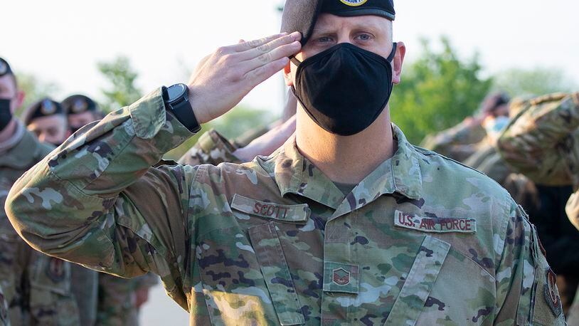 Master Sgt. David Scott, 88th Security Forces Squadron, salutes during the national anthem at a ceremony prior to his squadron’s annual ruck march May 10 at Wright-Patterson Air Force Base. The event marked the beginning of the Police Week activities. U.S. AIR FORCE PHOTO/R.J. ORIEZ