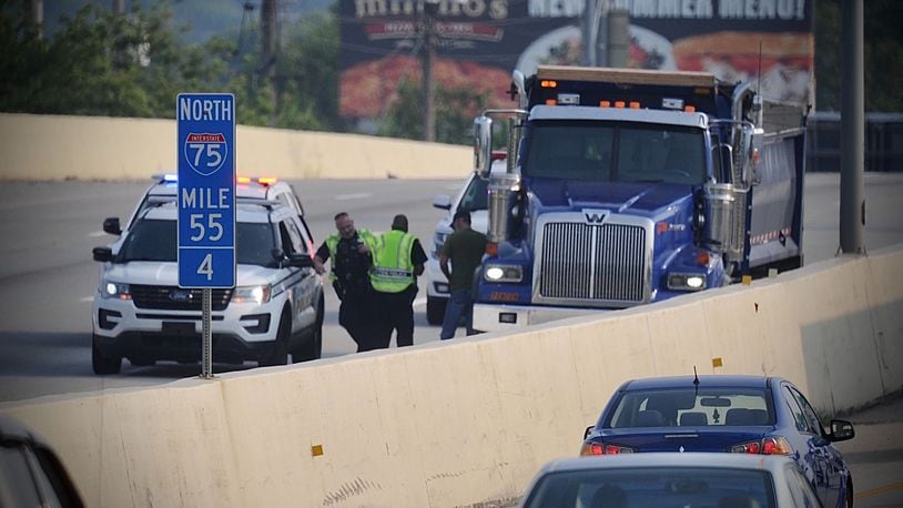 At least one person was killed in a two-vehicle crash involving a motorcycle on I-75 south near Stanley Avenue on Friday, July 30, 2021. MARSHALL GORBY / STAFF