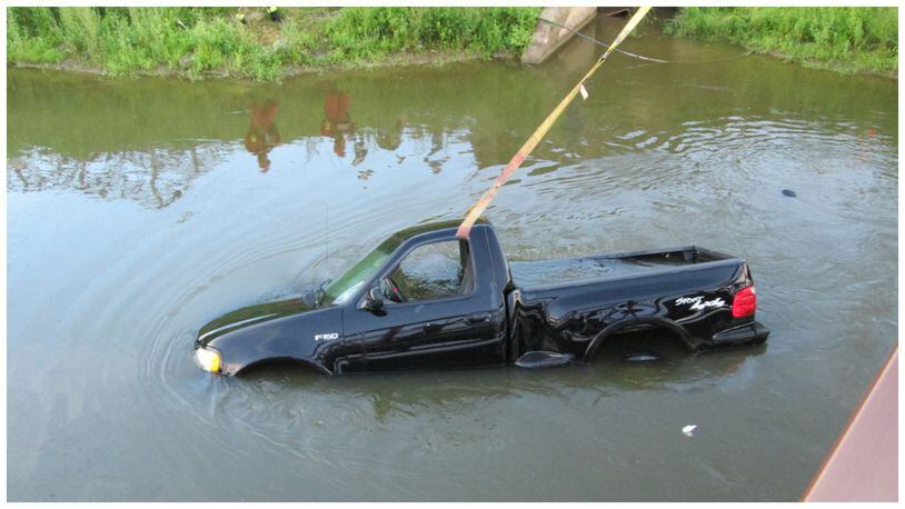 A Ford F150 truck was pulled from the Ford Canal in Hamilton on Monday night after apparently popping out of gear and rolling into the water.