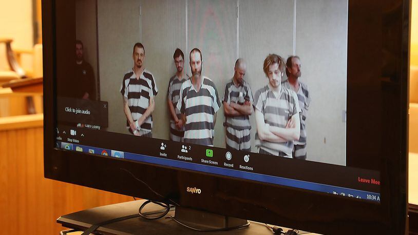 Steven Toms, center, appears Monday with other Clark County Jail inmates for their video arraignment, which is being used in Clark County Municipal Court in response to the coronavirus pandemic. BILL LACKEY/STAFF