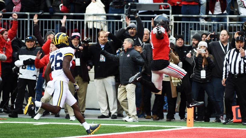 Curtis Samuel runs for the game-winning touchdown in Ohio State’s overtime win over Michigan. NICK FALZARANO/CONTRIBUTED