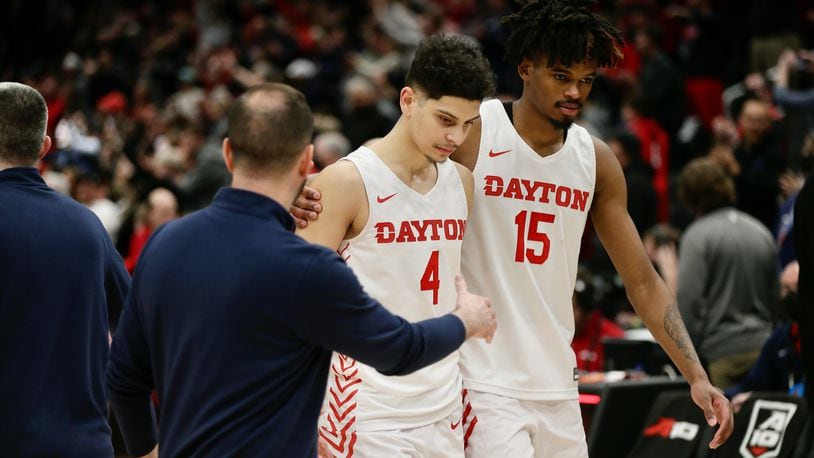 Dayton's Koby Brea and DaRon Holmes II leave the court after a loss to Richmond in the semifinals of the Atlantic 10 Conference tournament on Saturday, March 12, 2022, at Capital One Arena in Washington, D.C. David Jablonski/Staff