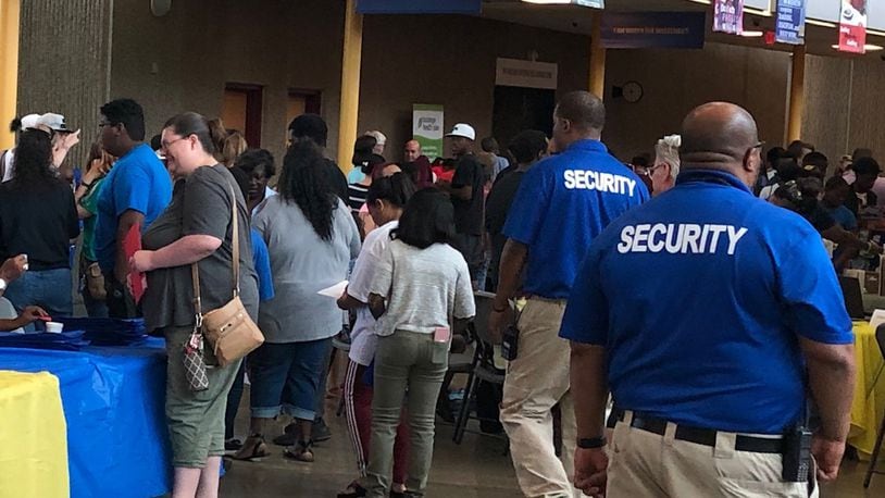 Dayton Public Schools security resource officers work at an August 2019 back-to-school event at Ponitz Career Technology Center. JEREMY P. KELLEY / STAFF