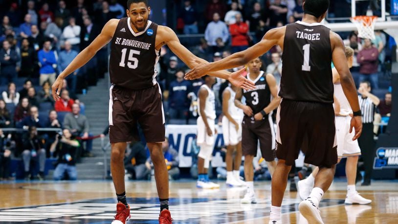 DAYTON, OH - MARCH 13: LaDarien Griffin #15 and Idris Taqqee #1 of the St. Bonaventure Bonnies celebrate their team’s late game lead over the UCLA Bruins during the second half of the First Four game in the 2018 NCAA Men’s Basketball Tournament at UD Arena on March 13, 2018 in Dayton, Ohio. The St. Bonaventure Bonnies defeated the UCLA Bruins 65-58. (Photo by Kirk Irwin/Getty Images)