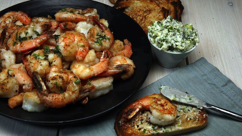Shrimp are dusted with cornstarch before a quick spin in a hot skillet. The crispy crustaceans partner with a mint-chile butter. (Terrence Antonio James/Chicago Tribune/TNS)