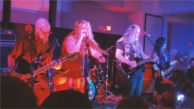 Dayton-based horror punks the Creepy Crawlers, (left to right) Gory Cory, Scarika Watson, Danny Grim, Rev. Chad Wells and P.J. Wells, play its first hometown show at Cosmic Joe’s Atomic Lounge in Dayton on Friday.