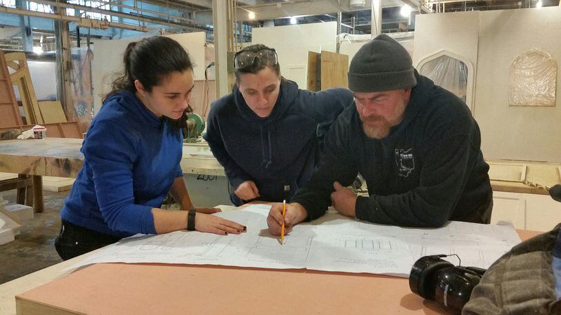 Working on the set for Dayton Opera are (l-r) carpenters Molly Lamperis and Abby Kuchar and technical director Tristan Cupp. SUBMITTED PHOTO