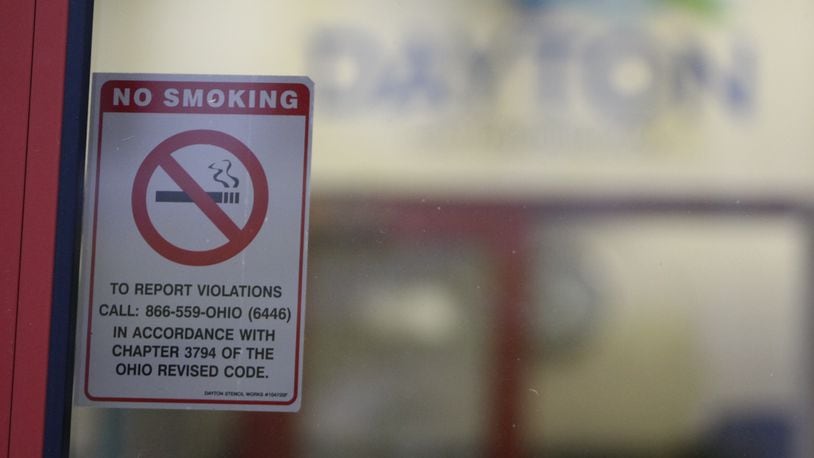 A no-smoking sign posted on the entry doors to City Hall. CORNELIUS FROLIK / STAFF