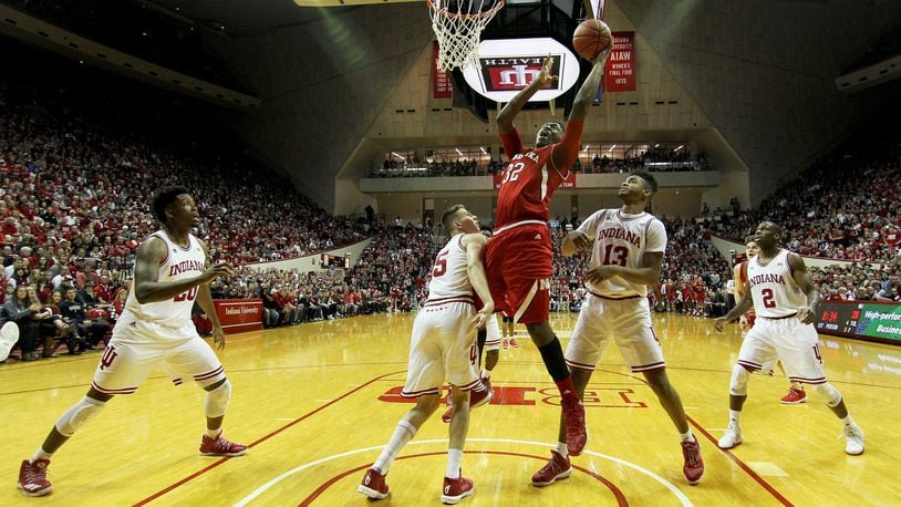 BLOOMINGTON, IN - DECEMBER 28: Jordy Tshimanga #32 of the Nebraska Cornhuskers attempts a layup over Zach McRoberts #15 of the Indiana Hoosiers in the first half at Assembly Hall on December 28, 2016 in Bloomington, Indiana. (Photo by Dylan Buell/Getty Images)
