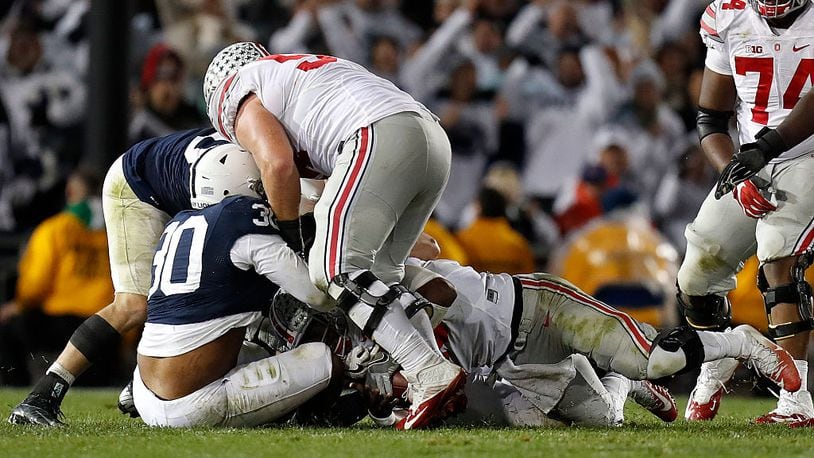 STATE COLLEGE, PA - OCTOBER 22: Kevin Givens #30 of the Penn State Nittany Lions sacks J.T. Barrett #16 of the Ohio State Buckeyes late in the fourth quarter during the game on October 22, 2016 at Beaver Stadium in State College, Pennsylvania. (Photo by Justin K. Aller/Getty Images)