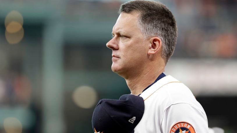 Houston Astros manager A.J. Hinch listens to the National Anthem before a baseball game against the Los Angeles Angels Saturday, June 10, 2017, in Houston. (AP Photo/David J. Phillip)