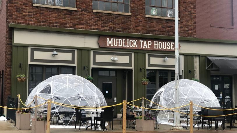 Mudlick Tap House, which operates a beer pub in downtown Dayton, has applied for a full liquor license for a second location in downtown Springboro. CORNELIUS FROLIK / STAFF