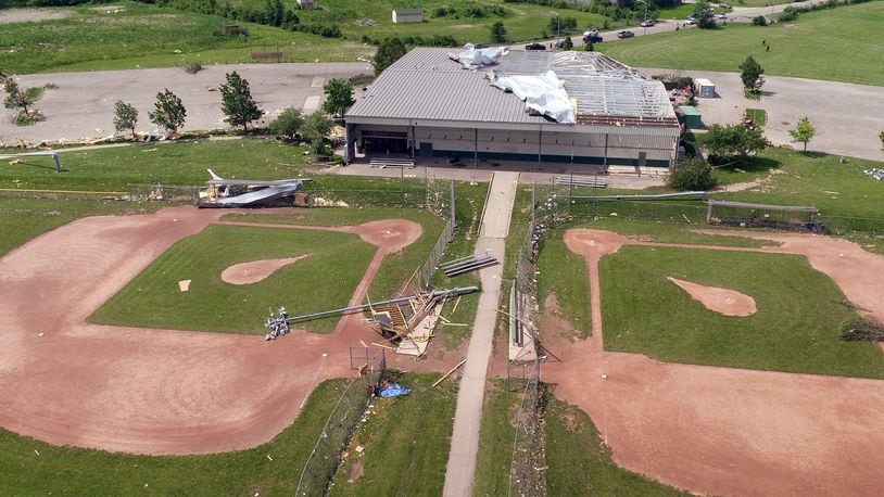 The Action Sports Center complex suffered extensive damage from a tornado on Monday night. Most of the roof was blown off. Light posts and fencing were flattened. TY GREENLEES / STAFF