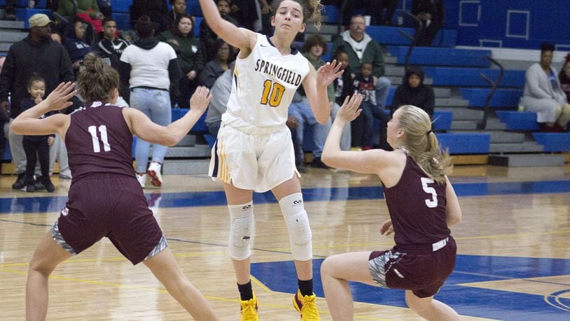 Springfield sophomore guard Mickayla Perdue passes over one of the many double-teams she faced Saturday in a 46-41 loss at home to Lebanon. Perdue scored 11 points. Jeff Gilbert/CONTRIBUTED