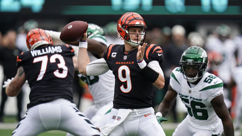 Cincinnati Bengals quarterback Joe Burrow looks to throw a pass during the first half of an NFL football game New York Jets, Sunday, Sept. 25, 2022, in East Rutherford, N.J. (AP Photo/Seth Wenig)