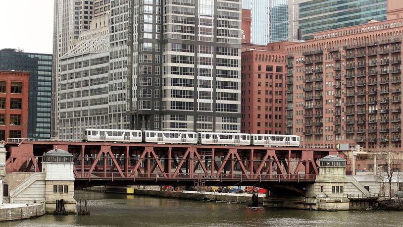 A train rumbles through downtown Chicago.