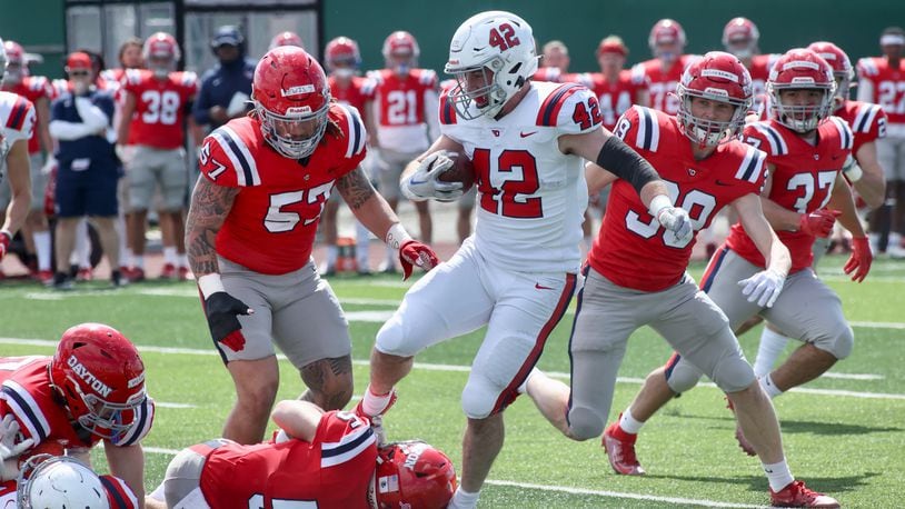 Dayton's Michael Neel runs in the annual spring football game on Sunday, April 2, 2023, at the Jerry Von Mohr Practice Facility in Dayton. David Jablonski/Staff