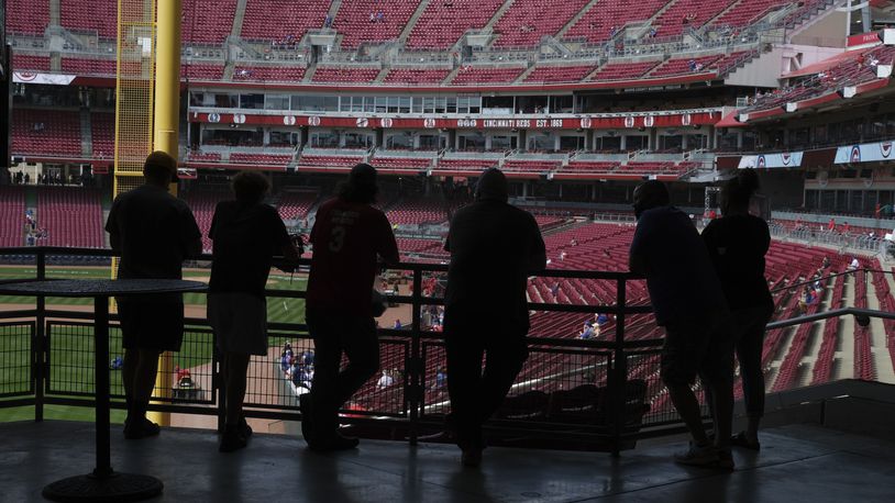 Fans stand in the concourse at Great American Ballpark prior to a baseball game between the Chicago Cubs and the Cincinnati Reds in Cincinnati on Sunday, May 2, 2021. (AP Photo/Jeff Dean)