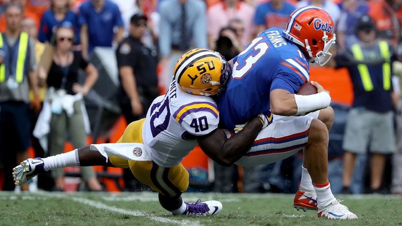 GAINESVILLE, FL - OCTOBER 07: Feleipe Franks #13 of the Florida Gators is sacked by Devin White #40 of the LSU Tigers during the game at Ben Hill Griffin Stadium on October 7, 2017 in Gainesville, Florida. (Photo by Sam Greenwood/Getty Images)