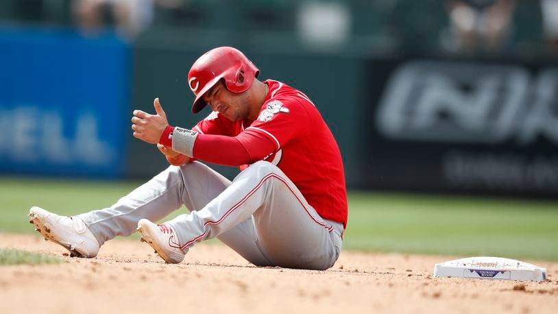 Cincinnati Reds' Jose Iglesias reacts after he was caught trying to steal second base by Colorado Rockies catcher Tony Wolters in the eighth inning of a baseball game Sunday, July 14, 2019, in Denver.(AP Photo/David Zalubowski)